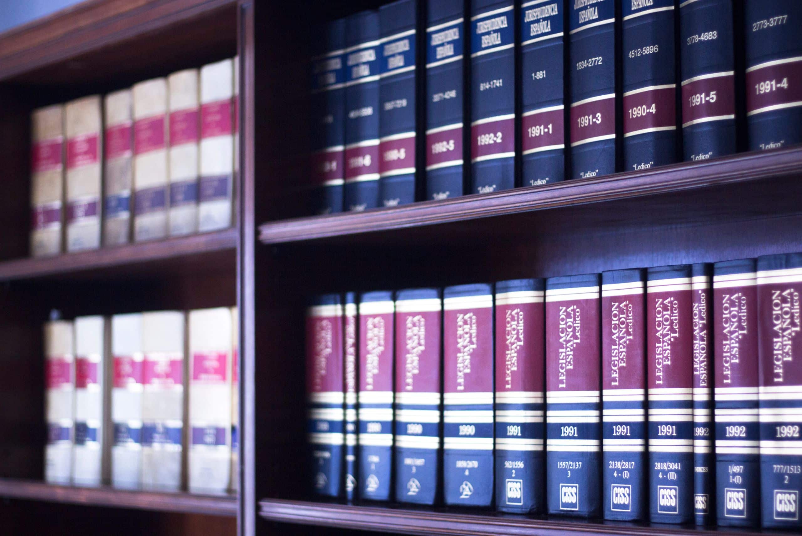 legal books and law reports on shelves in a law library